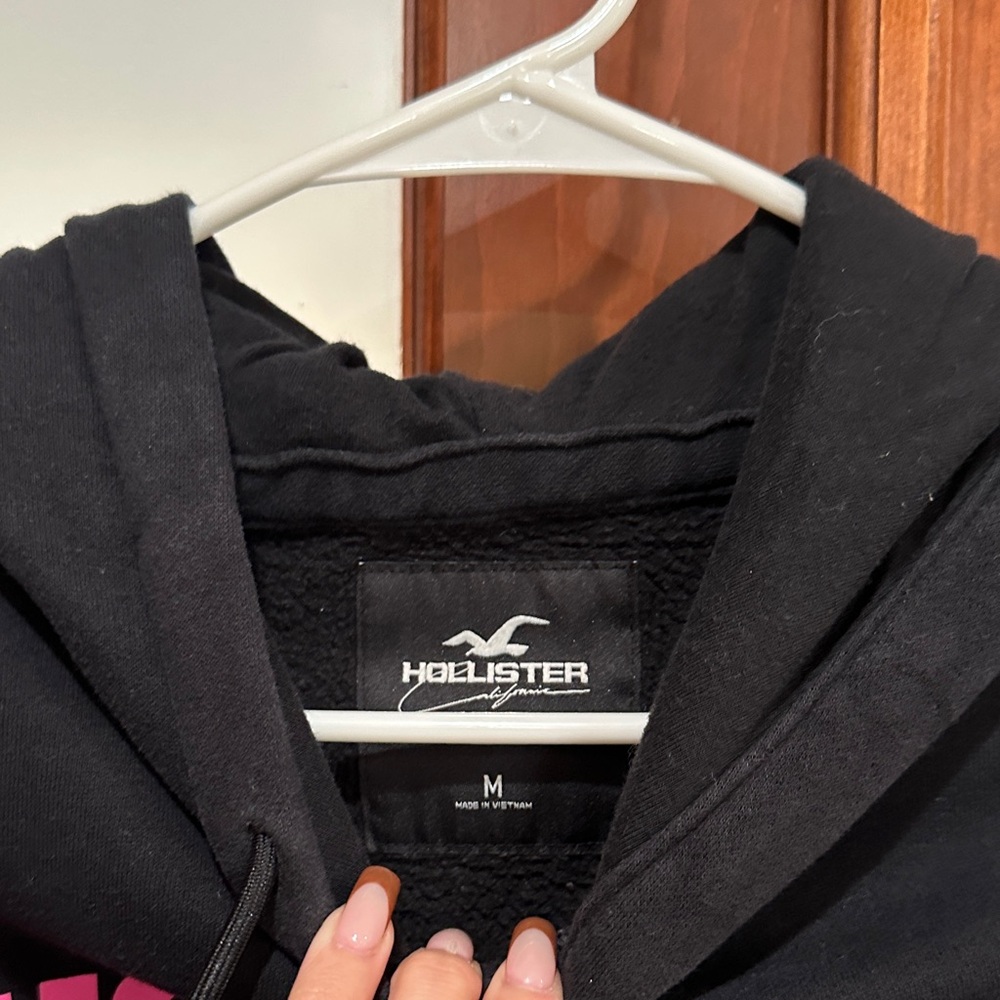 Hollister Black Hoodie with Pink and Blue Text - Picture 2 of 2